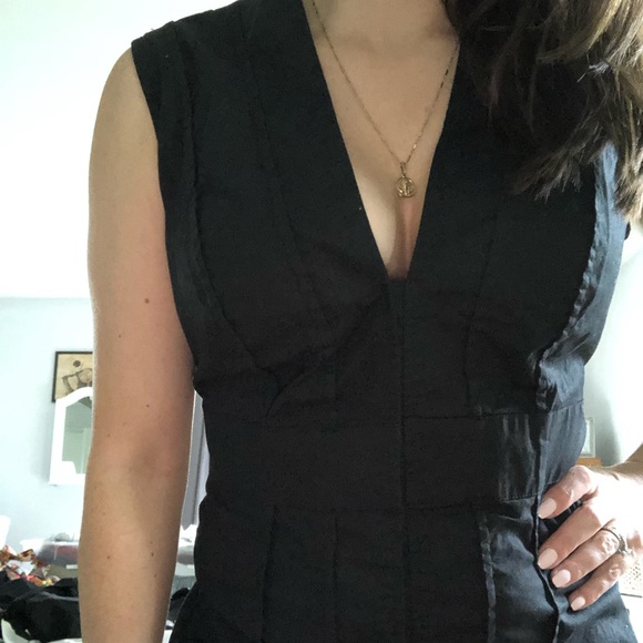 Black sleeveless button down blouse